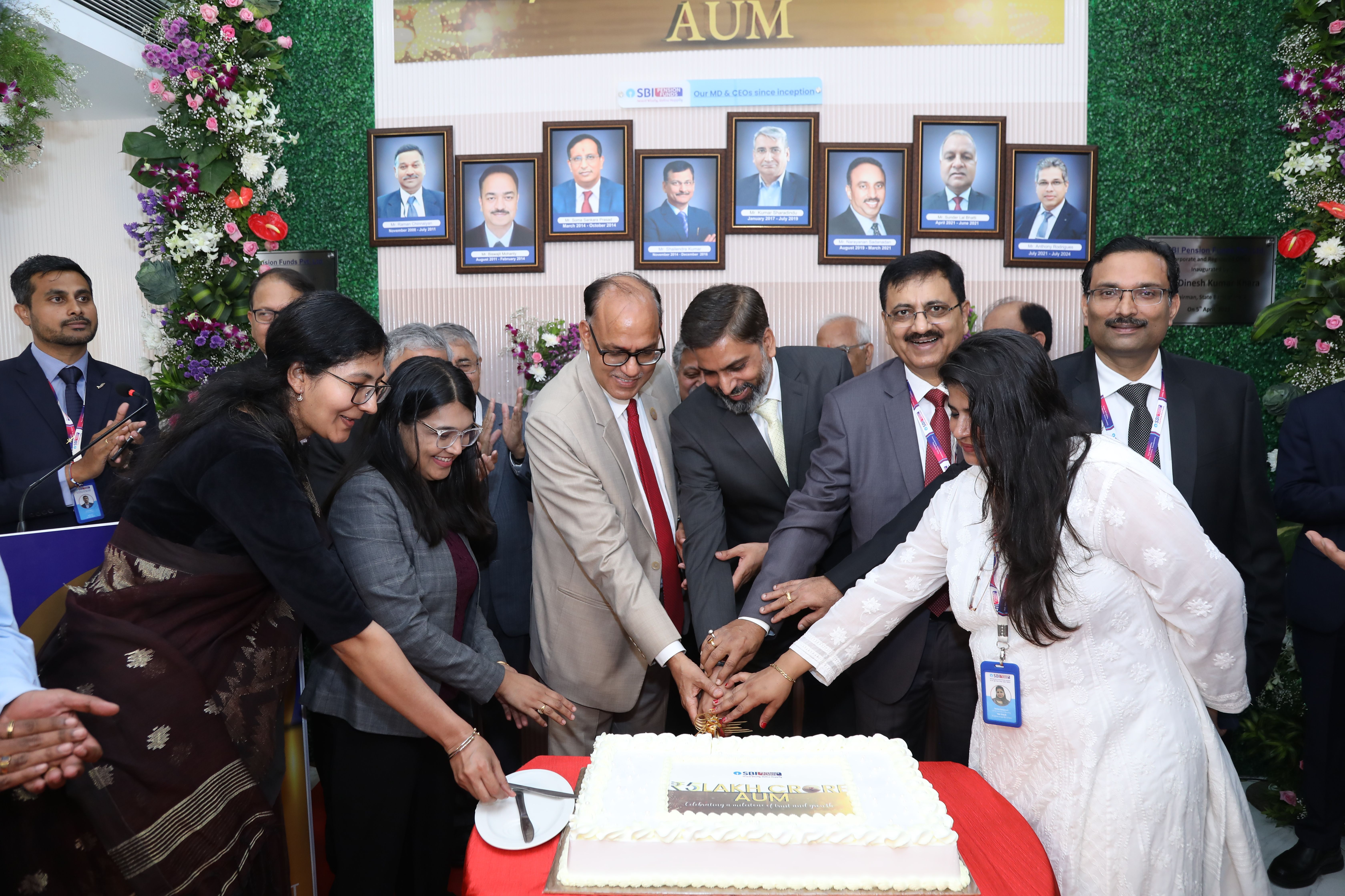 People celebrating cake cutting event